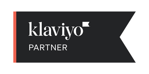 Black ribbon-style Klaviyo Partner badge indicating official certification, used to showcase trusted email marketing support for eshop businesses.