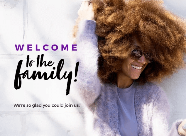Cheerful welcome email featuring a smiling woman in sunglasses and curly hair, with bold purple text reading “Welcome to the family! We’re so glad you could join us.”