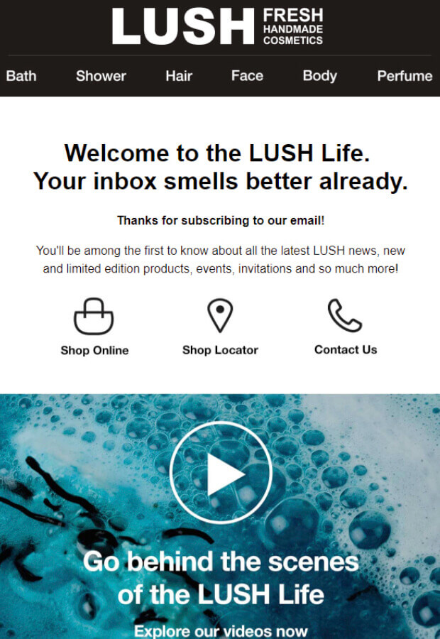 A branded email marketing newsletter design from LUSH Cosmetics welcoming new subscribers with playful copy that says “Your inbox smells better already.” The layout features bold headings, icons for shopping and contact options, and a video preview section inviting readers to go behind the scenes of the LUSH Life.